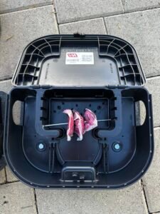 exterior rodent bait station filled with rodenticide inside of station